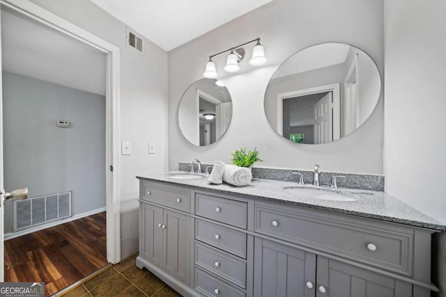 717 Beaufort Cir, Duluth, GA 30096 - bathroom with double vanity and baseboards