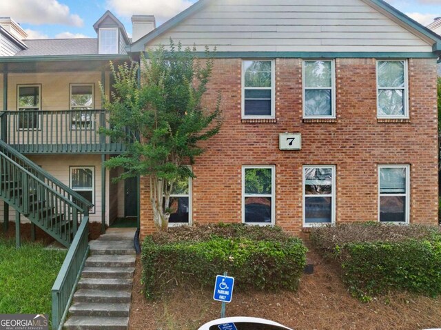717 Beaufort Cir, Duluth, GA 30096 - view of front of property with stairs, brick siding, and a chimney