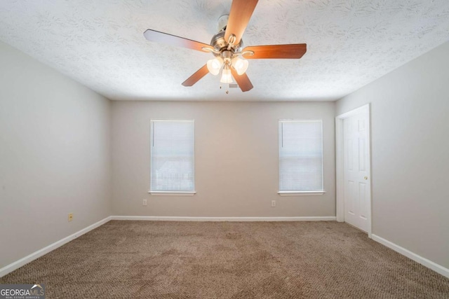 6509 Charter Way, Lithonia, GA 30058 - spare room with plenty of natural light, carpet floors, a ceiling fan, and a textured ceiling
