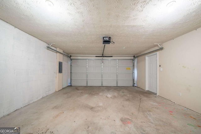 6509 Charter Way, Lithonia, GA 30058 - garage with a garage door opener, concrete block wall, and electric panel