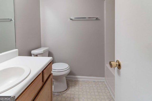 5614 Regency Forest Ct, Lithonia, GA 30038 - bathroom featuring vanity, toilet, tile patterned floors, and a tub to relax in