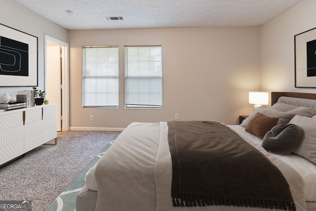 5614 Regency Forest Ct, Lithonia, GA 30038 - bedroom with carpet floors, baseboards, and a textured ceiling