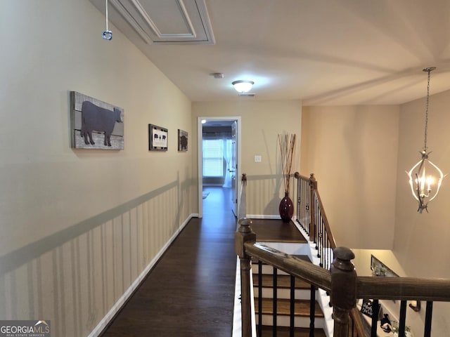4860 Berkeley Glen Dr, Peachtree Corners, GA 30092 - hall featuring an upstairs landing, attic access, dark wood-style floors, a chandelier, and baseboards