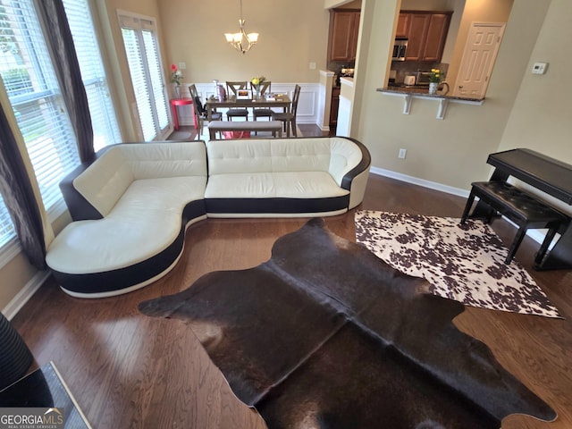 4860 Berkeley Glen Dr, Peachtree Corners, GA 30092 - living room featuring plenty of natural light, a chandelier, and baseboards