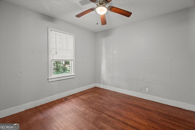 423 Clifton Ter, Carrollton, GA 30117 - empty room with wood finished floors, baseboards, a textured ceiling, and ceiling fan