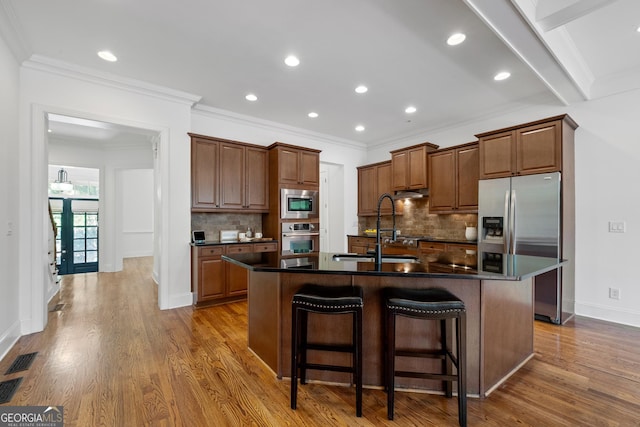 661 Lockton Pl # 9, Sandy Springs, GA 30342 - kitchen with stainless steel appliances, a sink, dark countertops, backsplash, and crown molding