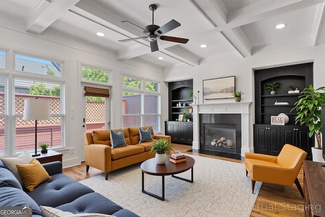 661 Lockton Pl # 9, Sandy Springs, GA 30342 - living room featuring coffered ceiling, light wood-type flooring, a ceiling fan, recessed lighting, and a fireplace with flush hearth