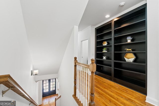 661 Lockton Pl # 9, Sandy Springs, GA 30342 - hall with an upstairs landing, wood finished floors, crown molding, and built in shelves