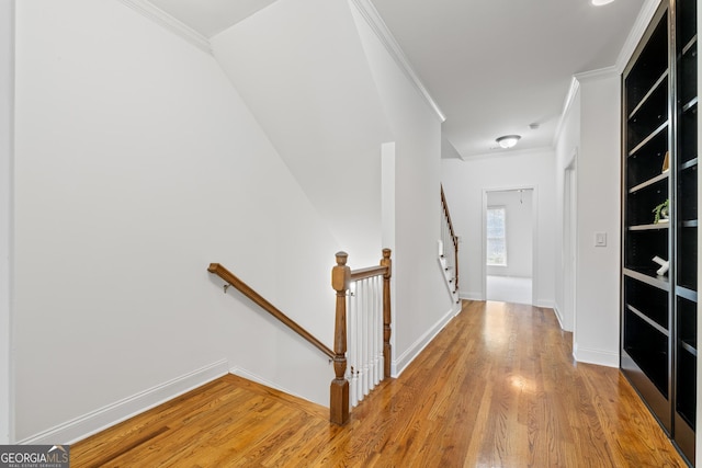 661 Lockton Pl # 9, Sandy Springs, GA 30342 - corridor featuring an upstairs landing, light wood-style floors, crown molding, and baseboards