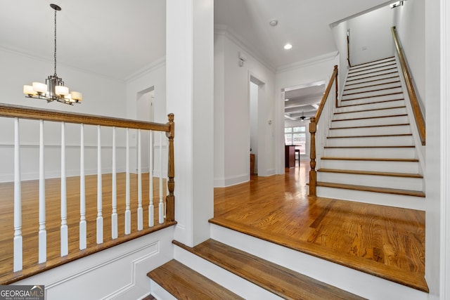 661 Lockton Pl # 9, Sandy Springs, GA 30342 - stairway featuring crown molding, a chandelier, recessed lighting, and baseboards