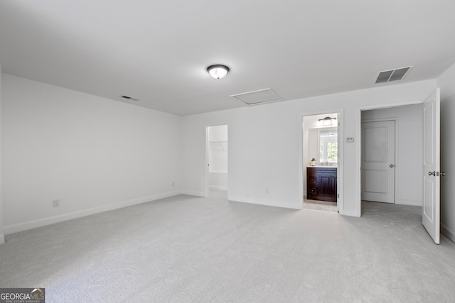 661 Lockton Pl # 9, Sandy Springs, GA 30342 - unfurnished bedroom featuring light colored carpet, baseboards, attic access, and a walk in closet