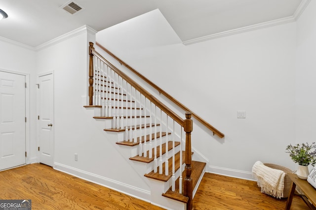 661 Lockton Pl # 9, Sandy Springs, GA 30342 - staircase featuring wood finished floors, ornamental molding, and baseboards