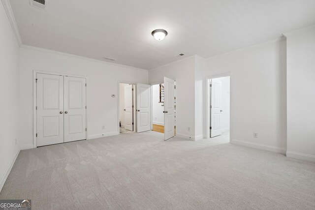 661 Lockton Pl # 9, Sandy Springs, GA 30342 - unfurnished bedroom with crown molding, light colored carpet, and baseboards