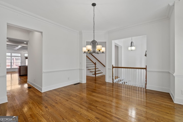 661 Lockton Pl # 9, Sandy Springs, GA 30342 - empty room featuring wood finished floors, a chandelier, ornamental molding, and baseboards