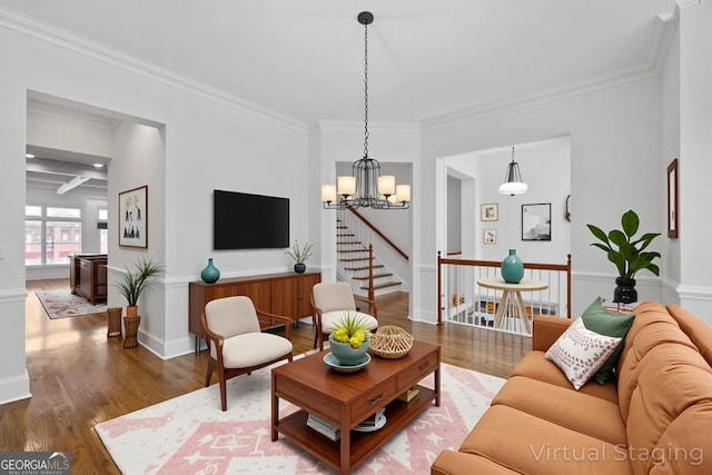 661 Lockton Pl # 9, Sandy Springs, GA 30342 - living room featuring wood finished floors, stairway, ornamental molding, a chandelier, and baseboards