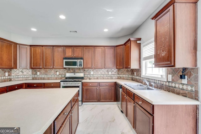 543 Serene Waters Trl, Jonesboro, GA 30236 - kitchen featuring stainless steel appliances, light marble finish flooring, light countertops, brown cabinets, and decorative backsplash