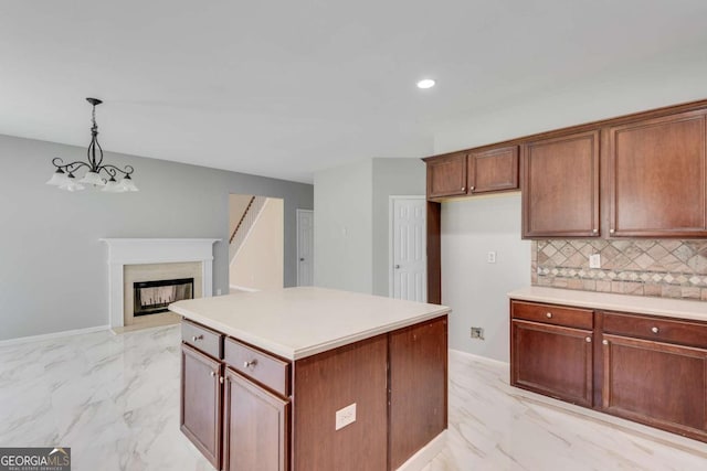 543 Serene Waters Trl, Jonesboro, GA 30236 - kitchen with light marble finish floors, decorative backsplash, light countertops, hanging light fixtures, and recessed lighting