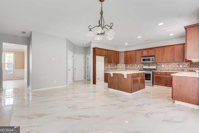 543 Serene Waters Trl, Jonesboro, GA 30236 - kitchen featuring stainless steel range, white microwave, a chandelier, light marble finish floors, and tasteful backsplash