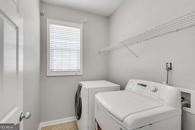 543 Serene Waters Trl, Jonesboro, GA 30236 - laundry room featuring washing machine and clothes dryer and baseboards