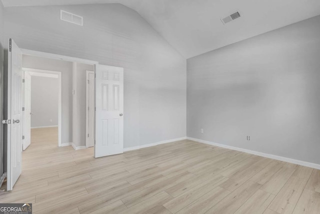 543 Serene Waters Trl, Jonesboro, GA 30236 - spare room with high vaulted ceiling, light wood-style floors, and baseboards