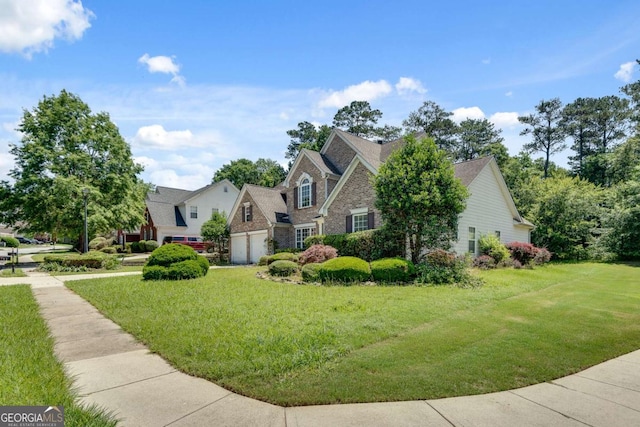 543 Serene Waters Trl, Jonesboro, GA 30236 - view of front of property with a garage, a front yard, and stone siding
