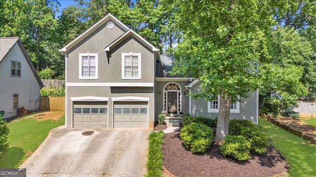 1359 Chatley Way, Woodstock, GA 30188 - view of front of property featuring stucco siding, an attached garage, and concrete driveway