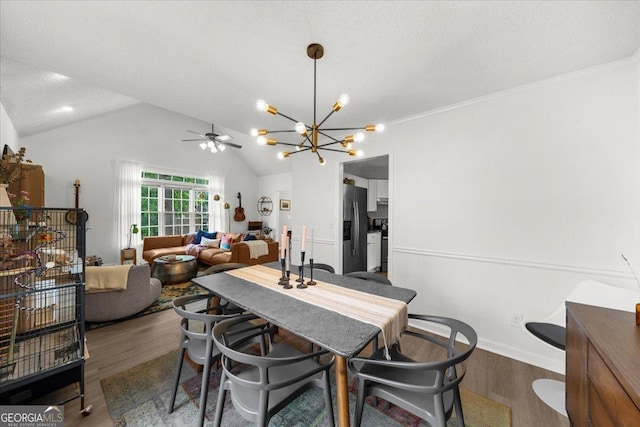 1359 Chatley Way, Woodstock, GA 30188 - dining area featuring wood finished floors, a chandelier, lofted ceiling, and ceiling fan