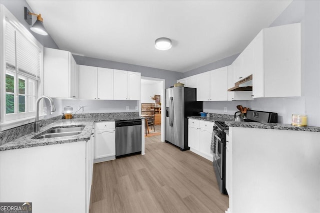 1359 Chatley Way, Woodstock, GA 30188 - kitchen with stainless steel appliances, a sink, under cabinet range hood, light wood-style flooring, and white cabinets