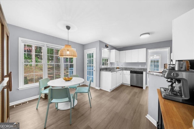 1359 Chatley Way, Woodstock, GA 30188 - kitchen with dishwasher, wood finished floors, white cabinetry, a sink, and baseboards