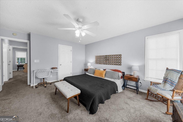 1359 Chatley Way, Woodstock, GA 30188 - carpeted bedroom featuring baseboards, a textured ceiling, and ceiling fan