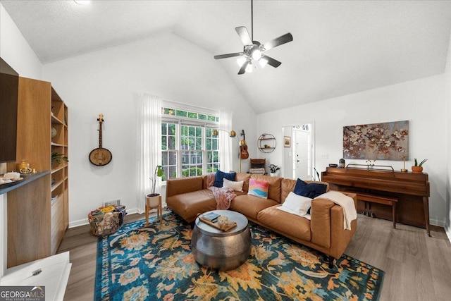 1359 Chatley Way, Woodstock, GA 30188 - living area featuring high vaulted ceiling, ceiling fan, and light wood-style flooring