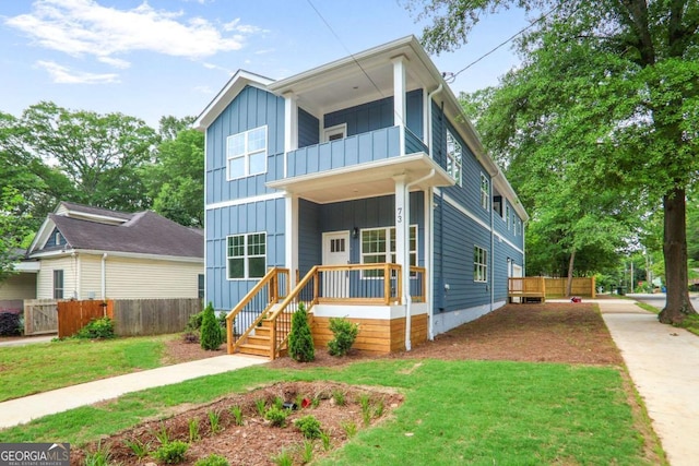 73 Whitefoord Ave SE, Atlanta, GA 30317 - modern home featuring board and batten siding, a balcony, and covered porch