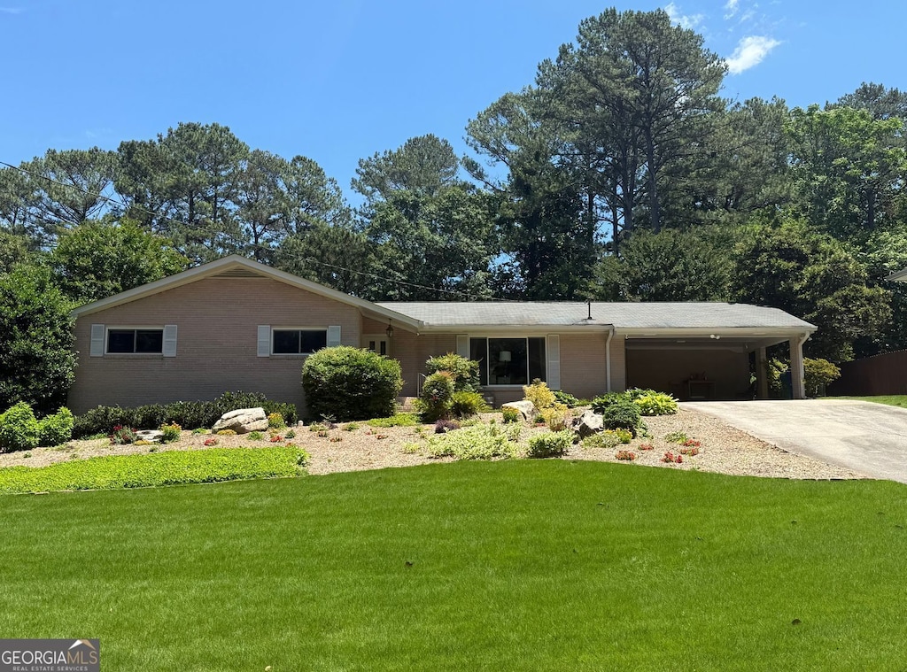 1533 High Haven Ct NE, Atlanta, GA 30329 - ranch-style home featuring concrete driveway, a front yard, and an attached carport