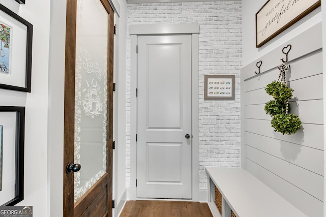 485 Delaperriere Loop, Jefferson, GA 30549 - mudroom featuring brick wall and dark wood finished floors