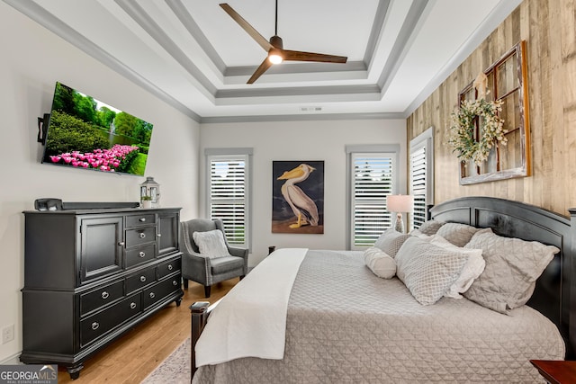 485 Delaperriere Loop, Jefferson, GA 30549 - bedroom featuring multiple windows, light wood finished floors, crown molding, a raised ceiling, and ceiling fan