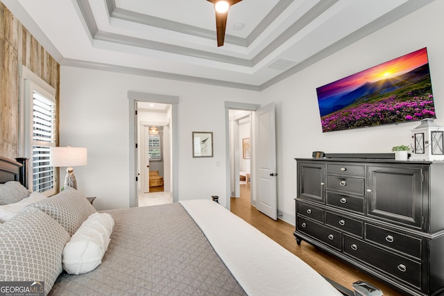 485 Delaperriere Loop, Jefferson, GA 30549 - bedroom featuring a tray ceiling and light wood-style flooring