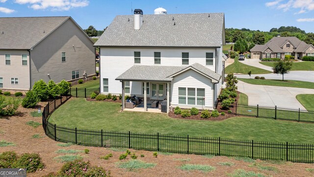 485 Delaperriere Loop, Jefferson, GA 30549 - back of property featuring a chimney, a shingled roof, a fenced backyard, and a patio