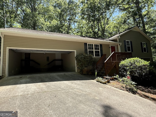 261 Sally Duke Dr, Whitesburg, GA 30185 - view of front facade featuring a garage and concrete driveway