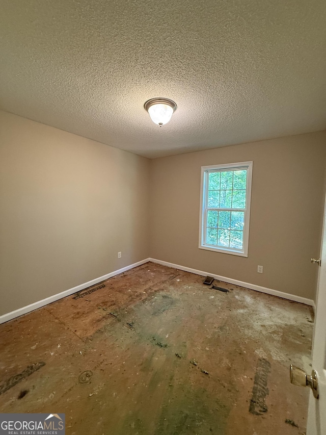 261 Sally Duke Dr, Whitesburg, GA 30185 - unfurnished room featuring a textured ceiling and baseboards
