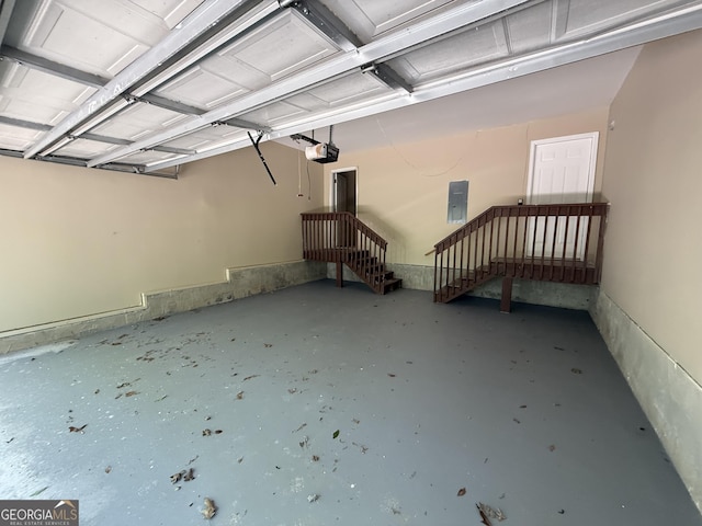 261 Sally Duke Dr, Whitesburg, GA 30185 - garage featuring electric panel and a garage door opener