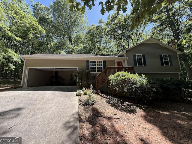 261 Sally Duke Dr, Whitesburg, GA 30185 - split level home with concrete driveway and an attached garage
