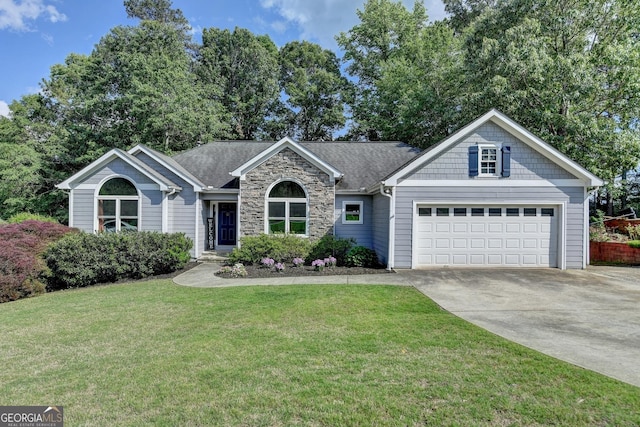 1882 Flowering Dr, Grayson, GA 30017 - view of front facade with concrete driveway, an attached garage, a front yard, and stone siding