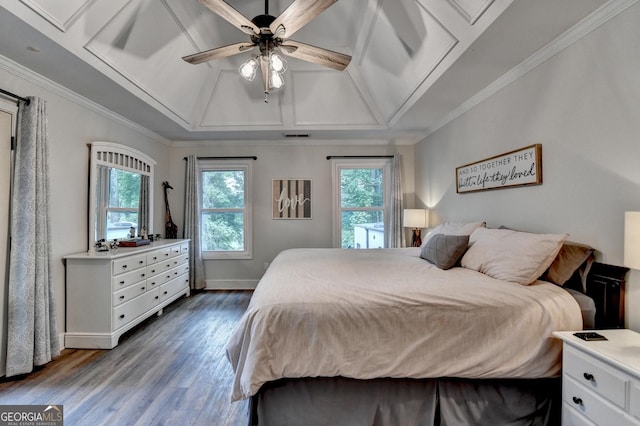1882 Flowering Dr, Grayson, GA 30017 - bedroom with wood finished floors, vaulted ceiling, ceiling fan, baseboards, and crown molding