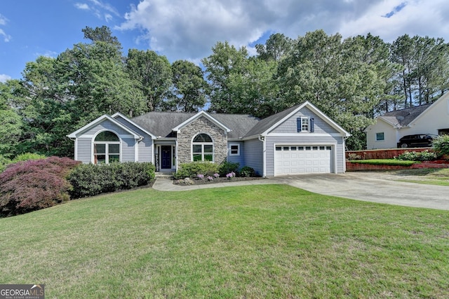 1882 Flowering Dr, Grayson, GA 30017 - ranch-style house with an attached garage, concrete driveway, a front yard, and stone siding