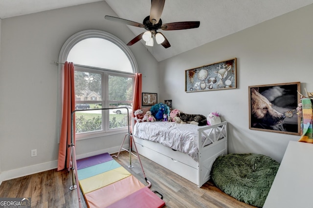 1882 Flowering Dr, Grayson, GA 30017 - bedroom featuring vaulted ceiling, wood finished floors, a ceiling fan, and baseboards