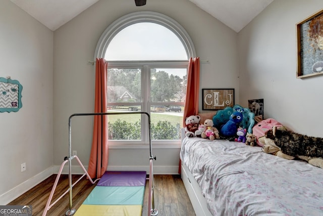 1882 Flowering Dr, Grayson, GA 30017 - bedroom featuring wood finished floors, vaulted ceiling, and baseboards