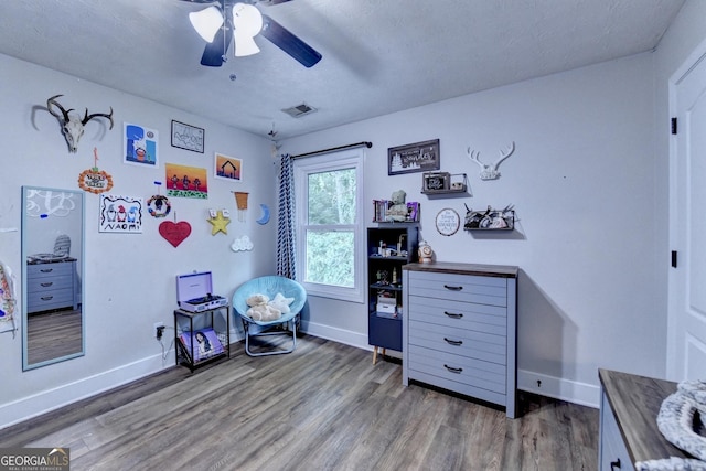 1882 Flowering Dr, Grayson, GA 30017 - bedroom with wood finished floors, baseboards, and a ceiling fan