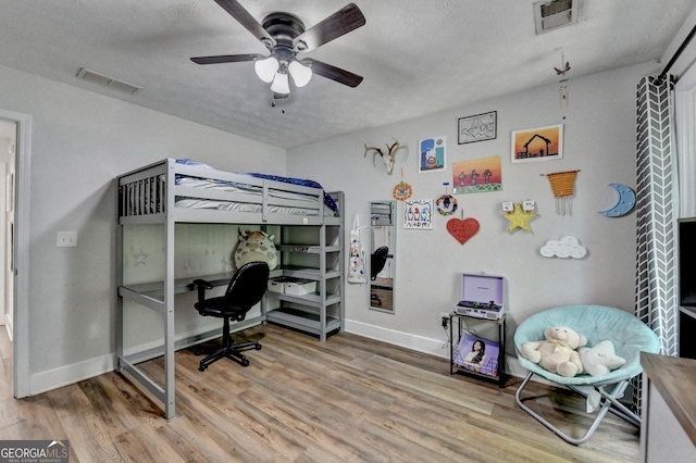 1882 Flowering Dr, Grayson, GA 30017 - bedroom featuring wood finished floors, baseboards, and ceiling fan