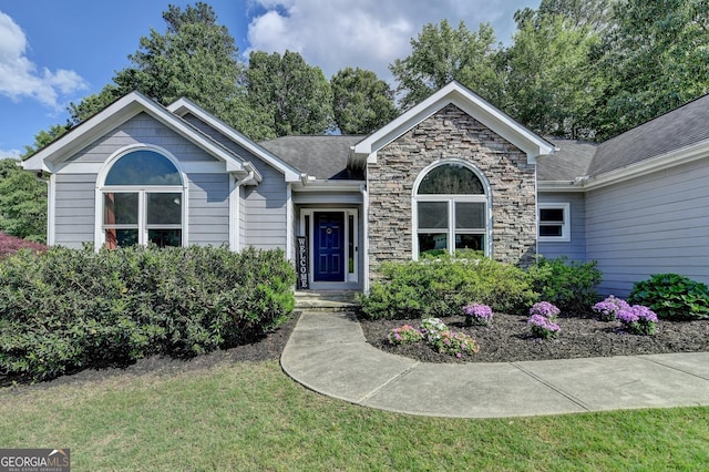 1882 Flowering Dr, Grayson, GA 30017 - ranch-style home with a front lawn and stone siding