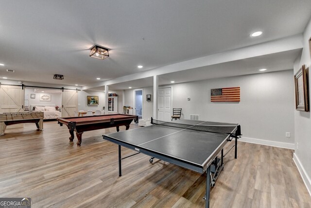 1882 Flowering Dr, Grayson, GA 30017 - recreation room with a barn door, light wood-style flooring, baseboards, recessed lighting, and billiards table